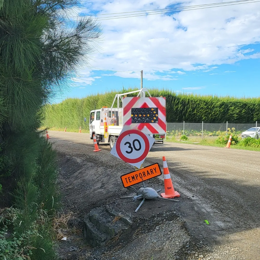 BTM truck with temporary speed limit signage on a rural road